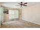 Bedroom featuring neutral carpet, ceiling fan, and natural light at 1792 Presidio Dr, Clermont, FL 34711