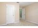 Neutral bedroom featuring a carpet, and doors leading to other rooms at 1792 Presidio Dr, Clermont, FL 34711