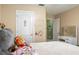Cozy bedroom with door to hallway and vanity with mirror and drawers at 1792 Presidio Dr, Clermont, FL 34711