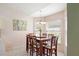 Cozy dining room featuring a large table, bright natural light, and a charming chandelier at 1792 Presidio Dr, Clermont, FL 34711