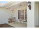 Charming front porch with decorative accents and three chairs for relaxing at 1792 Presidio Dr, Clermont, FL 34711