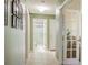 Hallway view with doorways leading to bathroom, bedroom, and office/den at 1792 Presidio Dr, Clermont, FL 34711