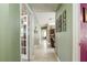 Hallway with tile flooring, leading to a living room and other rooms in the home at 1792 Presidio Dr, Clermont, FL 34711