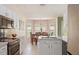 An eat-in kitchen includes a stainless steel oven, sink, and a dining table for convenience at 1792 Presidio Dr, Clermont, FL 34711