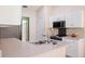 Bright kitchen features white cabinets, stainless steel appliances, and a double sink at 1792 Presidio Dr, Clermont, FL 34711