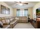 Cozy living room with a comfortable leather sectional sofa and entertainment center at 1792 Presidio Dr, Clermont, FL 34711
