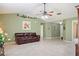 Open-concept living room with tile flooring, neutral decor, and seamless flow to other living spaces at 1792 Presidio Dr, Clermont, FL 34711