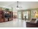 Spacious living room boasts vaulted ceilings, tile floors, and a cozy seating area with natural light at 1792 Presidio Dr, Clermont, FL 34711