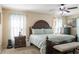 Spacious main bedroom with a ceiling fan, a king bed and two nightstands at 1792 Presidio Dr, Clermont, FL 34711