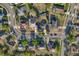 Overhead aerial view of a property with a well-manicured lawn and a tree-lined backyard at 181 Sutter Dr, Clermont, FL 34711