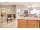 Open kitchen with stainless appliances, light-colored cabinets and an adjacent dining area at 181 Sutter Dr, Clermont, FL 34711