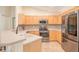 Beautiful kitchen with stainless steel appliances, tiled backsplash, and light-colored cabinetry at 181 Sutter Dr, Clermont, FL 34711