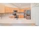 Modern kitchen featuring stainless steel appliances, light-colored cabinets and tiled backsplash at 181 Sutter Dr, Clermont, FL 34711