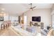 Bright living room featuring neutral walls, a ceiling fan, and tile flooring throughout at 181 Sutter Dr, Clermont, FL 34711