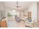 Cozy living room with large window providing ample natural light and comfortable seating arrangements at 181 Sutter Dr, Clermont, FL 34711