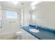 Fresh bathroom with updated vanity, shower-tub combo, and window for natural light at 20755 Queen Alexandra Dr, Leesburg, FL 34748