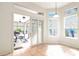 Bright breakfast nook with multiple windows and sliding doors to the outdoor patio at 20755 Queen Alexandra Dr, Leesburg, FL 34748