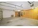 Large garage with an automatic door opener, peg board on walls and a utility area at 20755 Queen Alexandra Dr, Leesburg, FL 34748