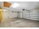 Spacious garage with high ceilings, an automatic door opener, and extra storage possibilities at 20755 Queen Alexandra Dr, Leesburg, FL 34748
