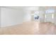 Expansive living room with tile floors and a large window with backyard views at 20755 Queen Alexandra Dr, Leesburg, FL 34748