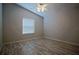 Bedroom with wood floors and a large window bringing in lots of natural light at 2082 Harston Trl, The Villages, FL 32162