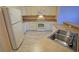 The kitchen features ample cabinet space and a full suite of appliances at 2082 Harston Trl, The Villages, FL 32162