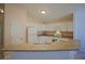 Well-lit kitchen with white cabinetry and updated appliances, offering a functional cooking space at 2082 Harston Trl, The Villages, FL 32162