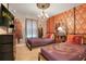 Unique bedroom showcases Harry Potter themed wallpaper, movie decorations and two twin beds at 2116 Lelani Cir, Davenport, FL 33897
