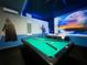 Basement game room with a pool table, decor featuring a Star Wars theme with a wall mural at 2116 Lelani Cir, Davenport, FL 33897