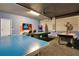 Spacious game room features ping pong, pool table, Star Wars decor, and fun for everyone at 2116 Lelani Cir, Davenport, FL 33897