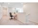 Cozy hallway features a built-in desk, carpet flooring and convenient access to other rooms in the home at 2116 Lelani Cir, Davenport, FL 33897