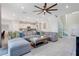 Spacious open floor plan showcases a large sectional sofa, modern kitchen, and a staircase at 2116 Lelani Cir, Davenport, FL 33897