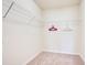 Bright walk-in closet features sturdy white wire shelving for optimal storage and organization at 2116 Lelani Cir, Davenport, FL 33897