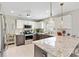 Stylish kitchen featuring stainless steel appliances, granite countertops, and ample counter space for cooking and entertaining at 2126 Sansores St, The Villages, FL 32159