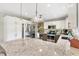 Modern kitchen with stainless steel appliances, granite countertops, breakfast bar, and plenty of cabinet storage at 2126 Sansores St, The Villages, FL 32159