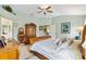 A spacious main bedroom with neutral paint, plush pillows, and an ensuite bath at 2126 Sansores St, The Villages, FL 32159