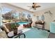 Comfortable outdoor seating area featuring wicker furniture and a delightful view of the swimming pool at 2126 Sansores St, The Villages, FL 32159
