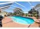 Enclosed pool area offers a refreshing swimming pool, comfortable seating, and plenty of room for activities at 2126 Sansores St, The Villages, FL 32159