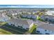 Aerial view of condos, manicured lawns, and convenient parking spaces at 213 Primrose Dr, Davenport, FL 33837