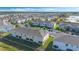 Aerial view showing manicured landscaping and nearby parking spaces at 213 Primrose Dr, Davenport, FL 33837