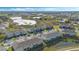 Aerial view of multi-Gathering homes with beautiful landscaping and serene ponds at 213 Primrose Dr, Davenport, FL 33837