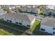 An aerial view of the back of the home, showing landscaping and privacy fence at 213 Primrose Dr, Davenport, FL 33837