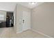 Entryway featuring tile flooring, white front door, and view of the kitchen at 213 Primrose Dr, Davenport, FL 33837