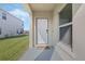 Welcoming front entrance with a covered porch and a charming 'HOME' doormat at 213 Primrose Dr, Davenport, FL 33837