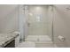 Clean and modern shower featuring a glass door and tiled walls and floor at 213 Primrose Dr, Davenport, FL 33837