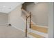 Wooden staircase with white railings, ascending from the living area, and tile flooring below at 213 Primrose Dr, Davenport, FL 33837