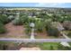 Drone shot of a property with trees and a long driveway showing its surrounding neighborhood at 21311 Sw Marine Blvd, Dunnellon, FL 34431