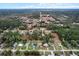 An aerial shot of the community, surrounded by green trees, and a meadow at 21311 Sw Marine Blvd, Dunnellon, FL 34431
