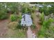 A lovely home features a screened-in pool area and solar panels on the roof amidst lush landscaping at 21311 Sw Marine Blvd, Dunnellon, FL 34431