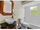 Updated bathroom with a vessel sink, unique mirror, and tiled shower/tub combo at 21311 Sw Marine Blvd, Dunnellon, FL 34431